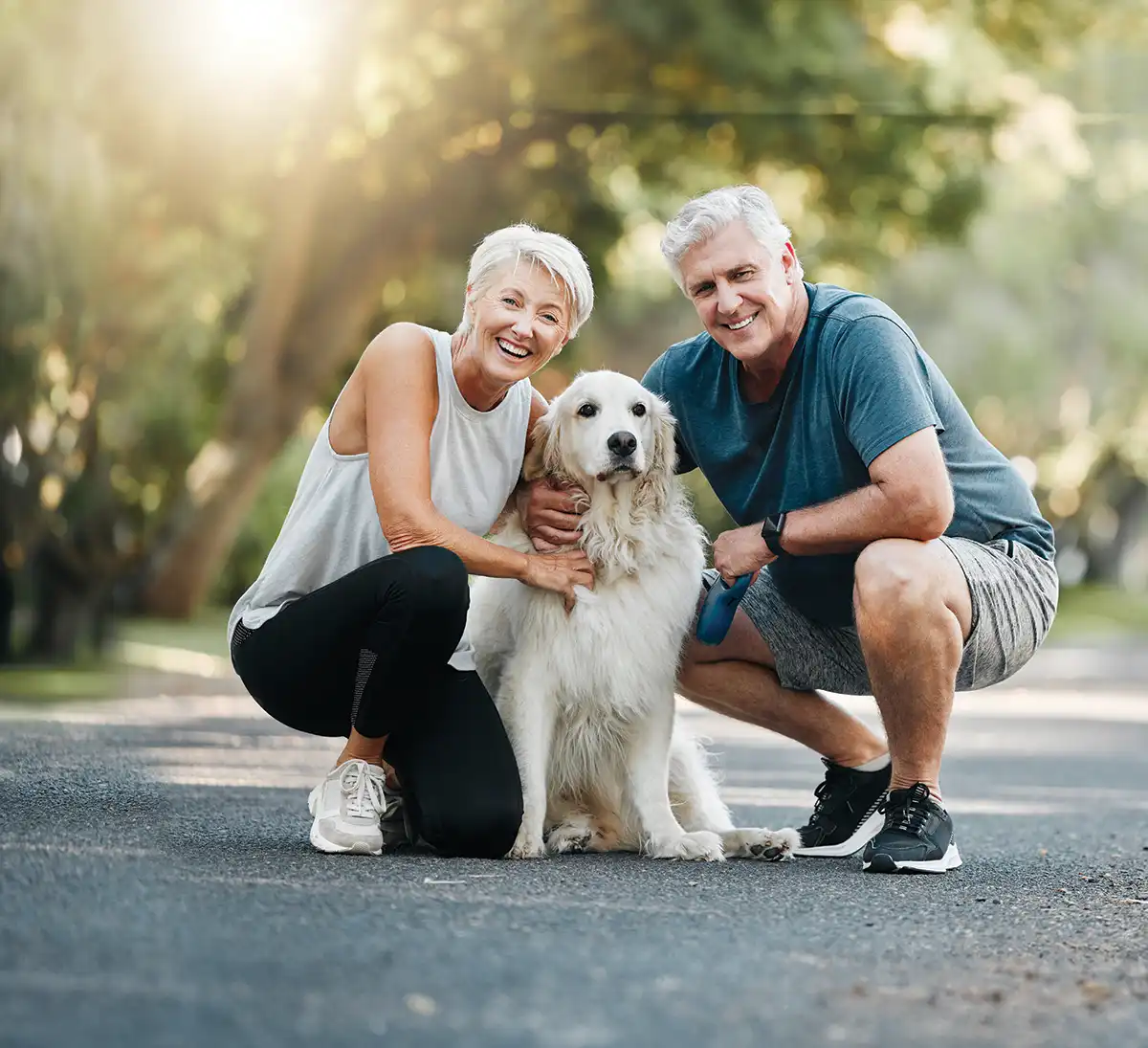 couple petting their dog