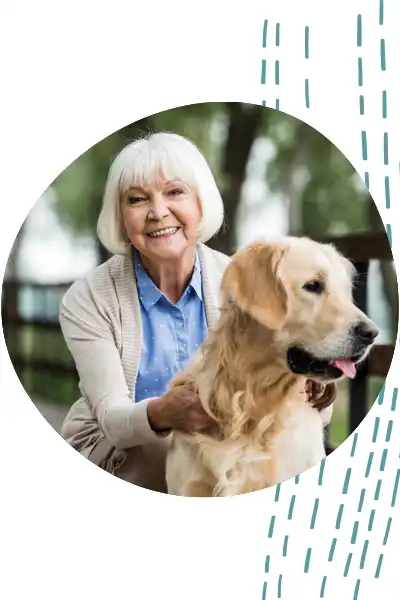 Woman petting her dog outside