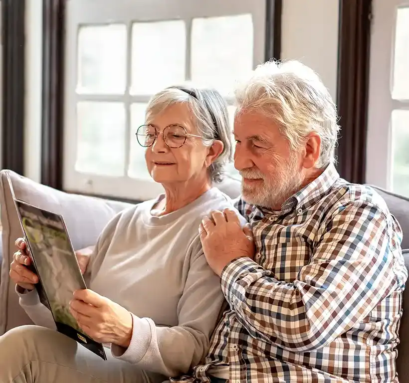 senior couple looking at a magazine