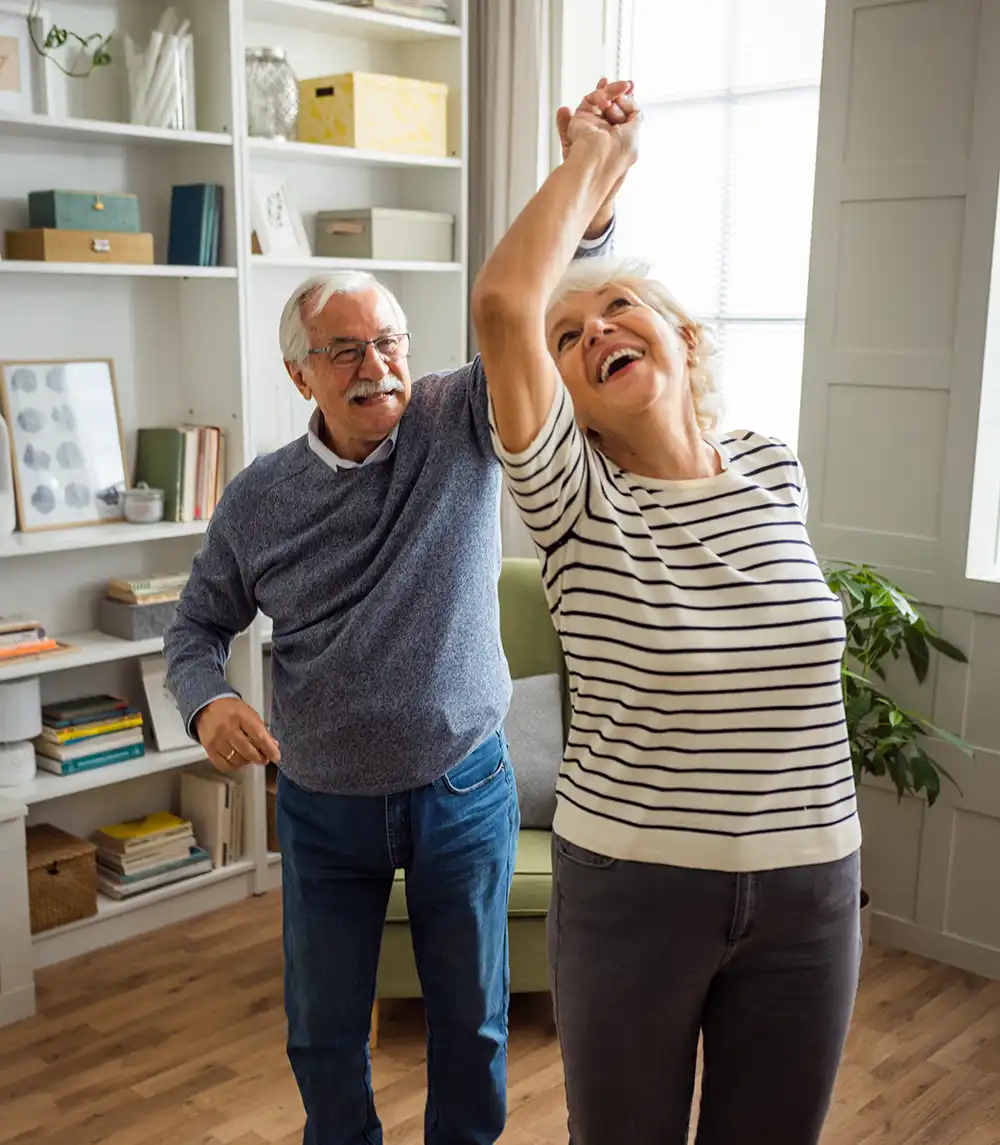 Couple dancing in their living room
