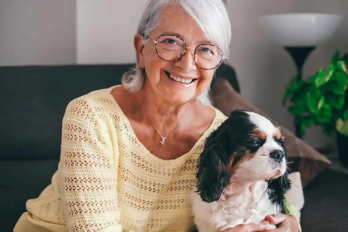Woman with her dog in the living room