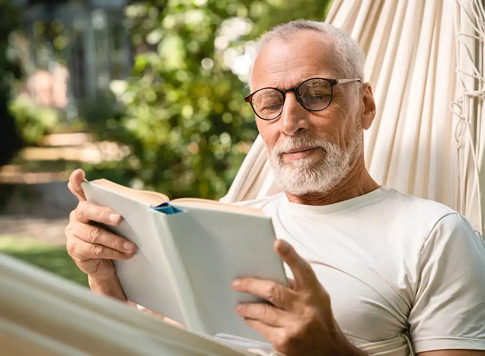 Man reading in a hammock