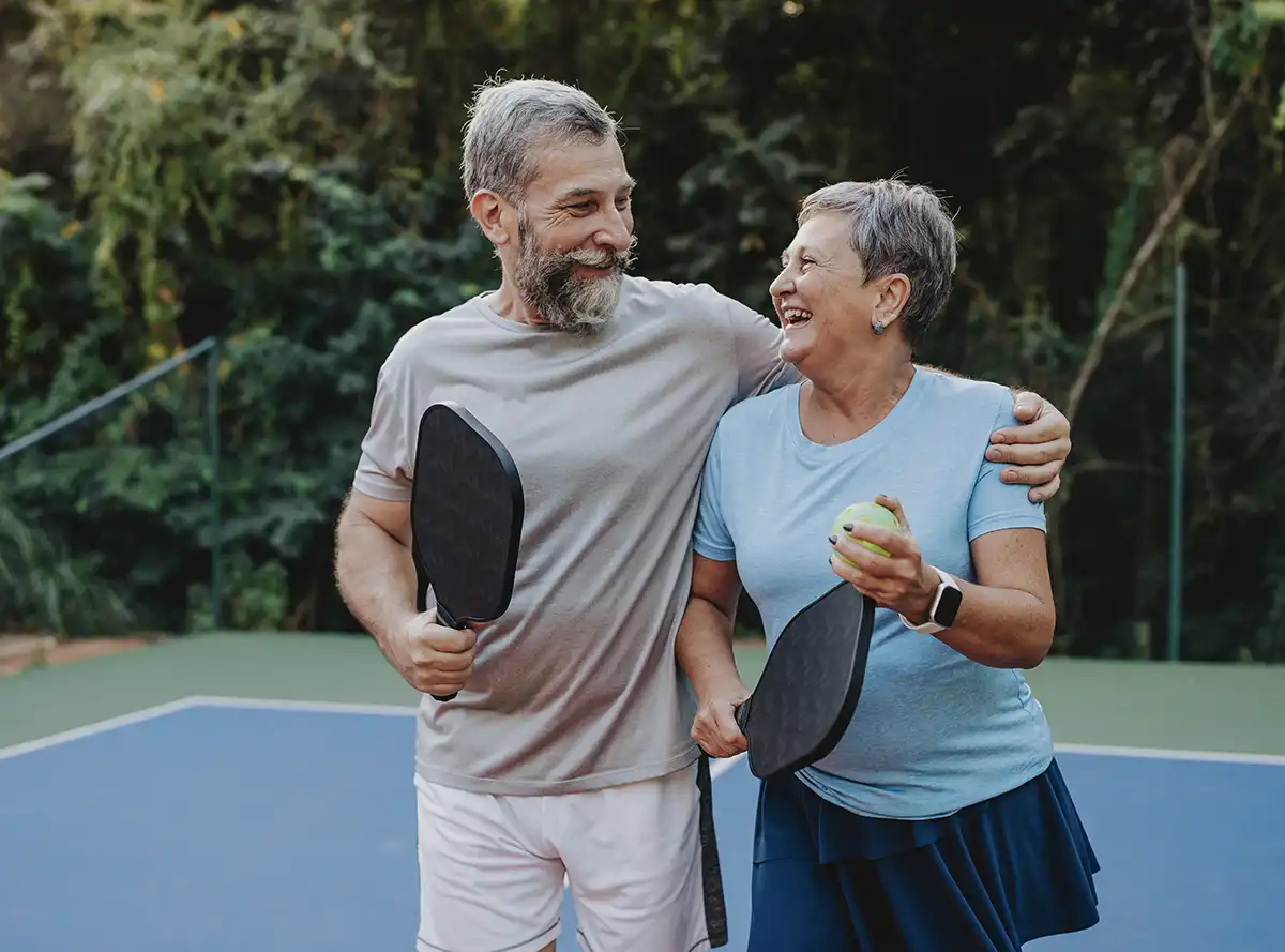 Couple playing pickleball